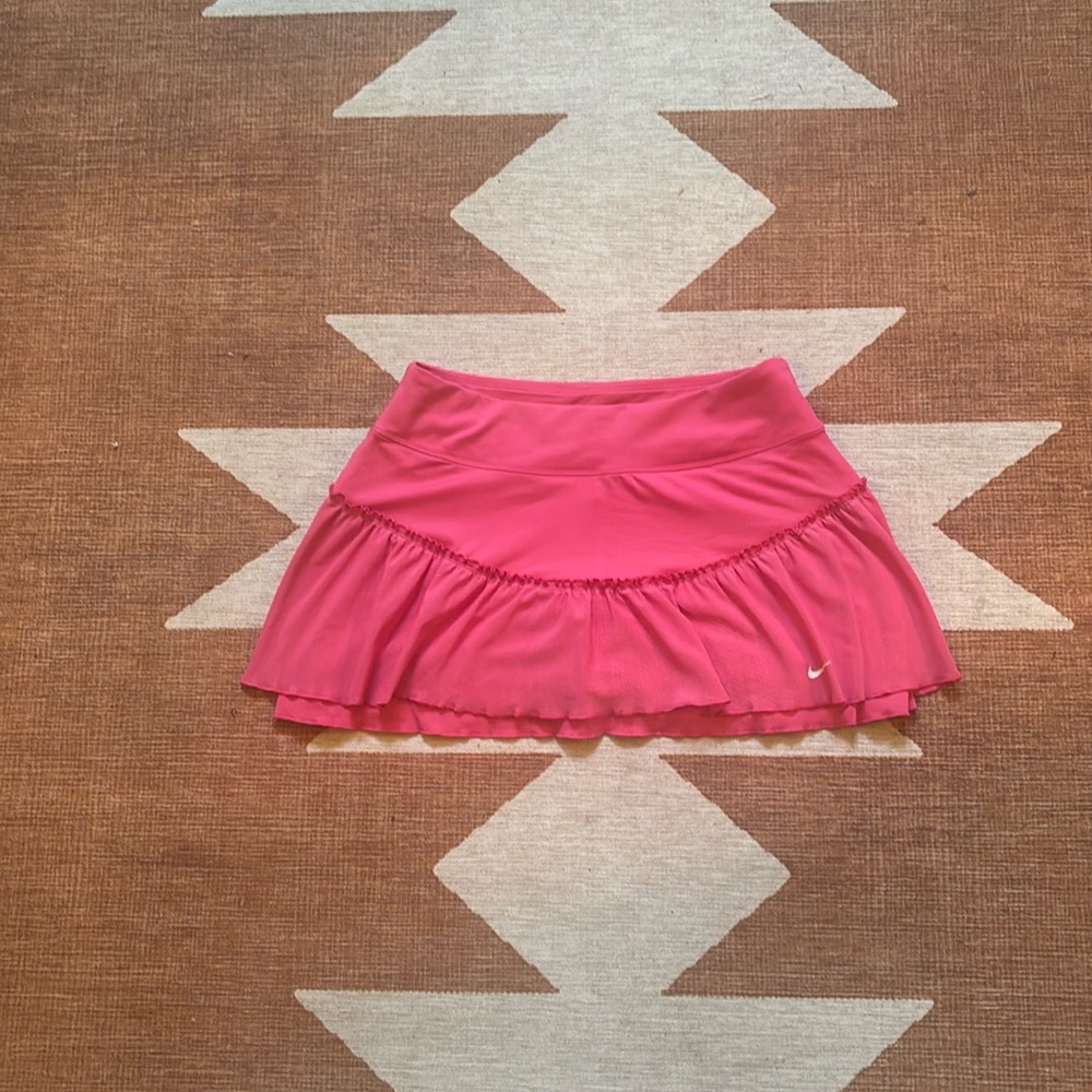 Small pink Dri-Fit Nike ruffled tennis skirt